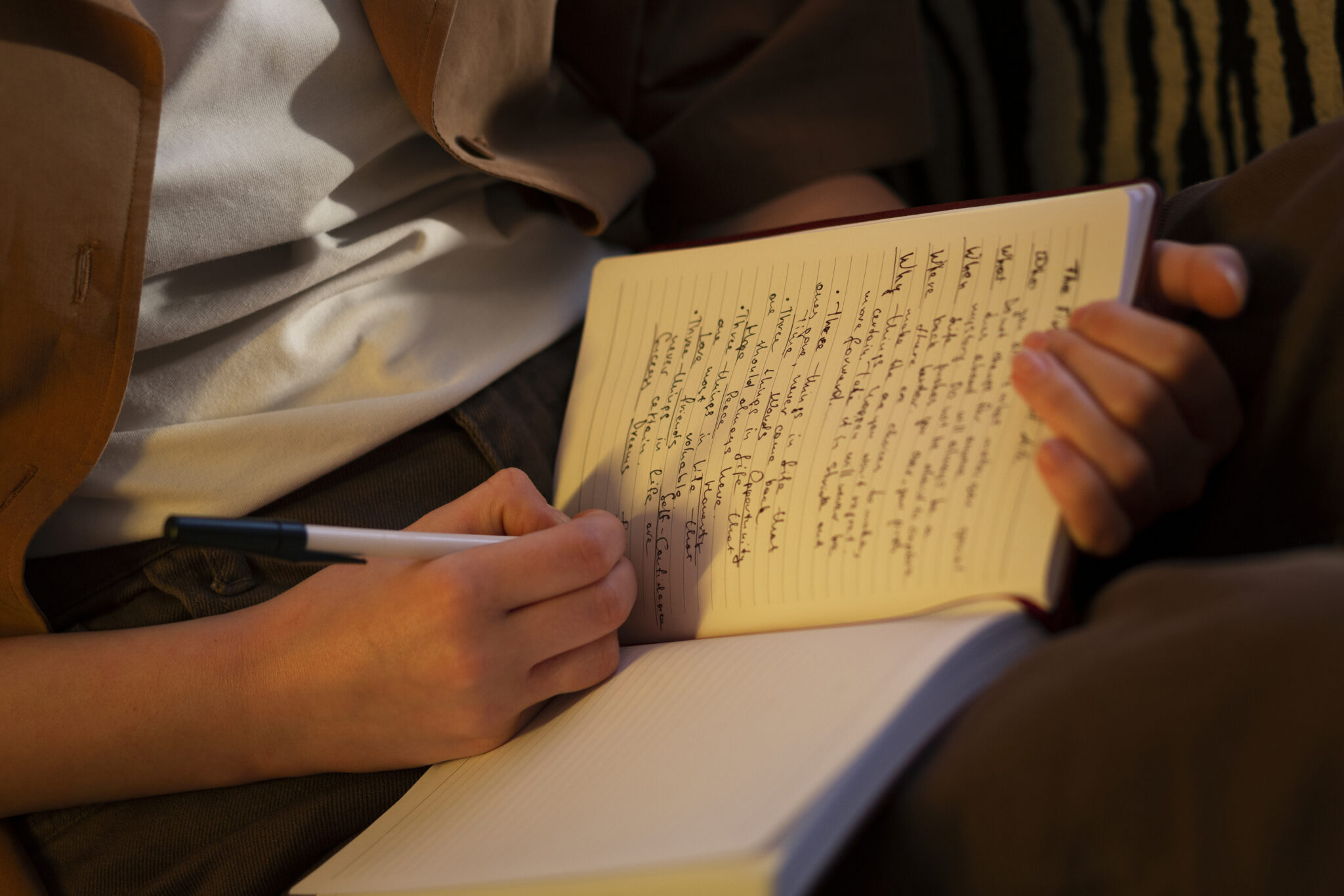 Content Writing/Story Writing 1 side view woman with journal home 2048x1365 1